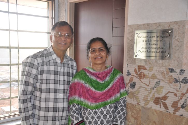 Dr. Geetha Yeruva and Tom Chitta of 'The Foundation for Children in Need' Standing before the room built for Erika Allen, mother of Marilynn Hughes, The Out-of-Body Travel Foundation. 