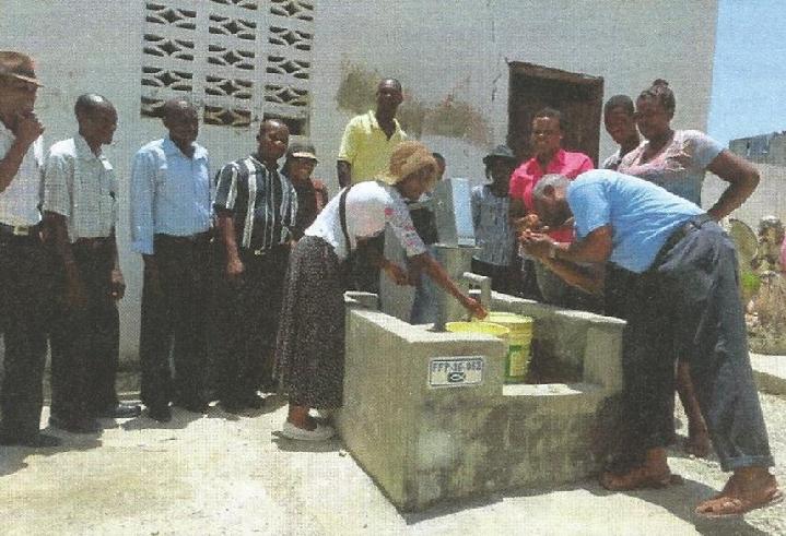 Food for the Poor, Well and Pump near Port Au Prince Haiti, Built by the Donations of the Out-of-Body Travel Foundation.
